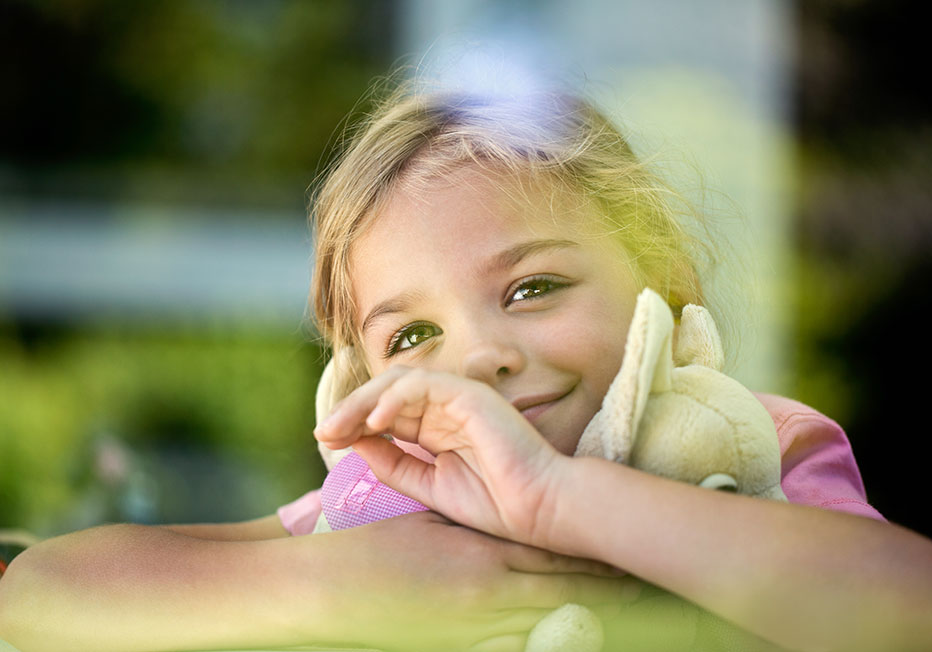 little girl looking out window